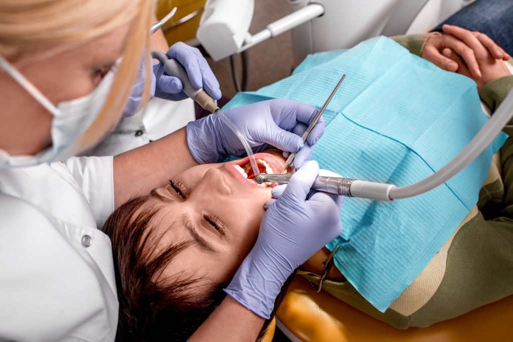 Woman undergoing a dental operation