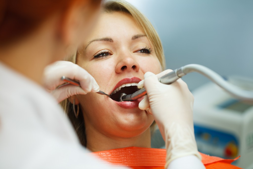 Patient having her teeth checked