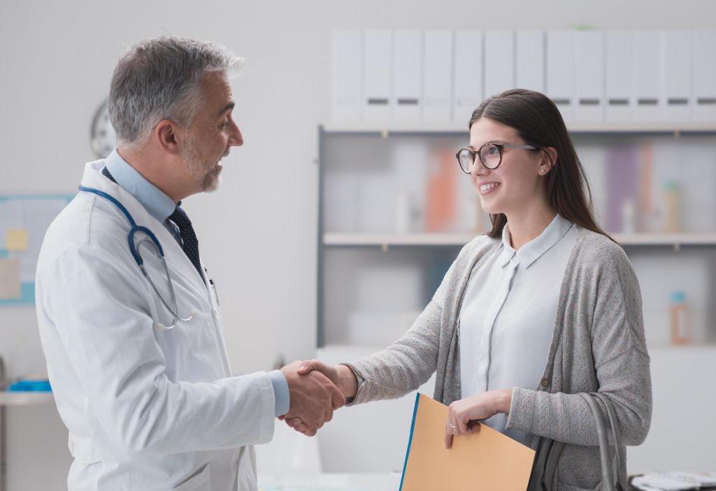 Patient shaking hands with the doctor