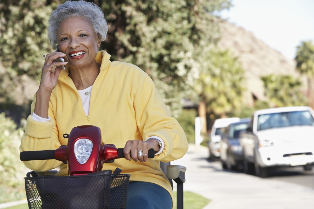 Woman riding a wheelchair scooter