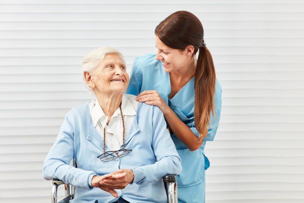 elderly woman and her caretaker