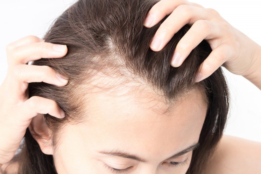 Woman touching her hair