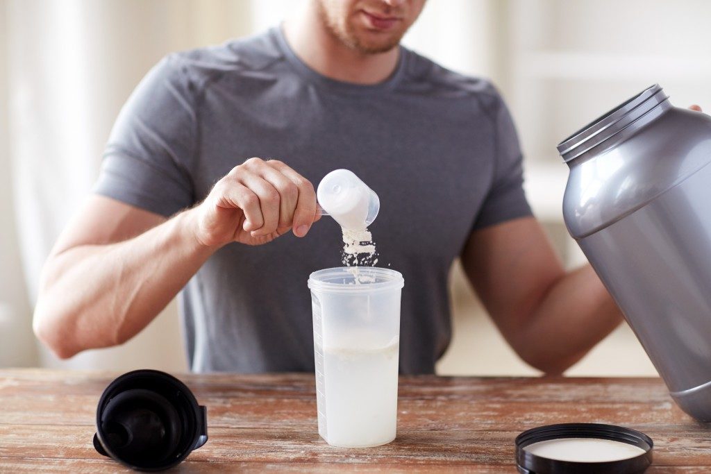 Man preparing a protein shake