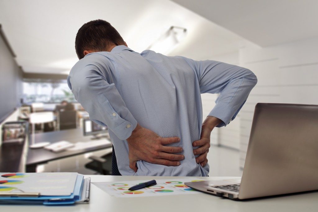 Man with backpain while at work