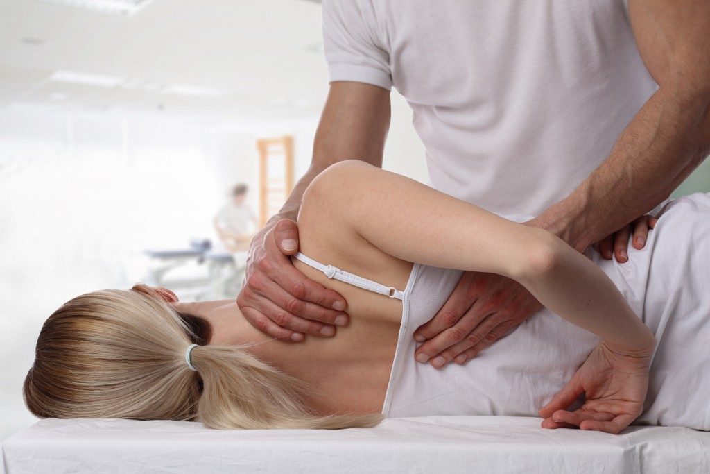 chiropractor about to crack a woman's back