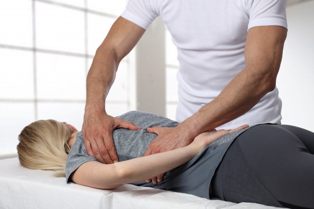 chiropractor treating a patient