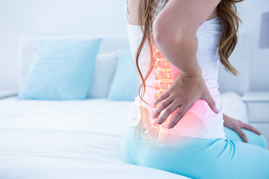 woman suffering from back pains