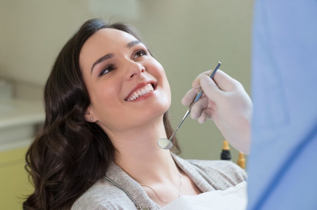 Woman smiling during dental check up