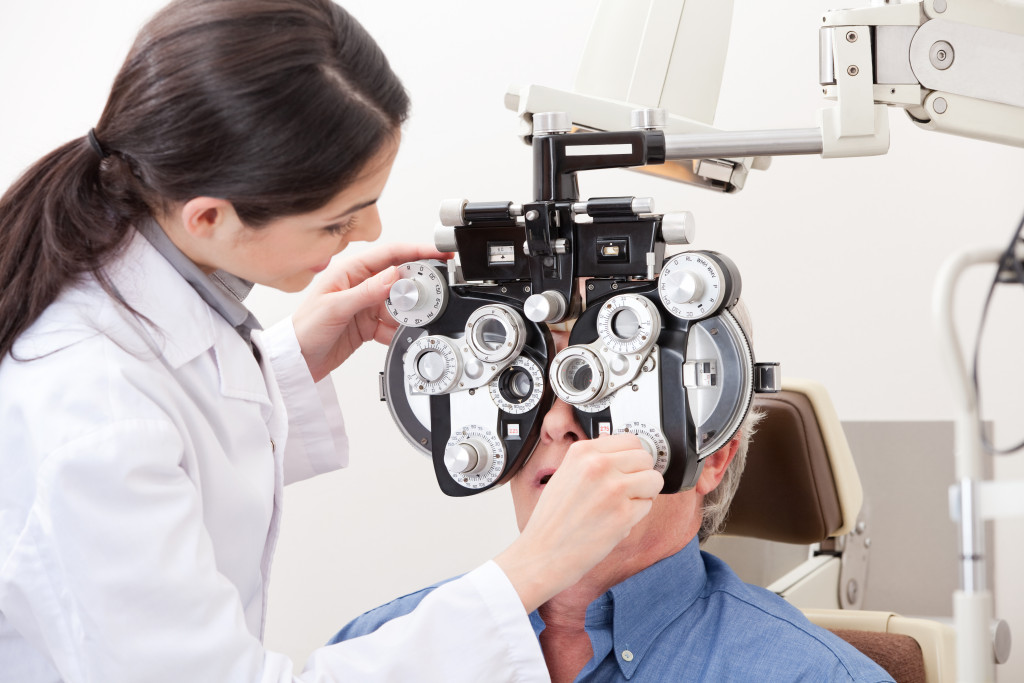 An older man getting his vision tested for glasses in a clinic