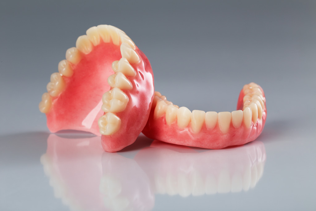 An image of dentures on a gray background