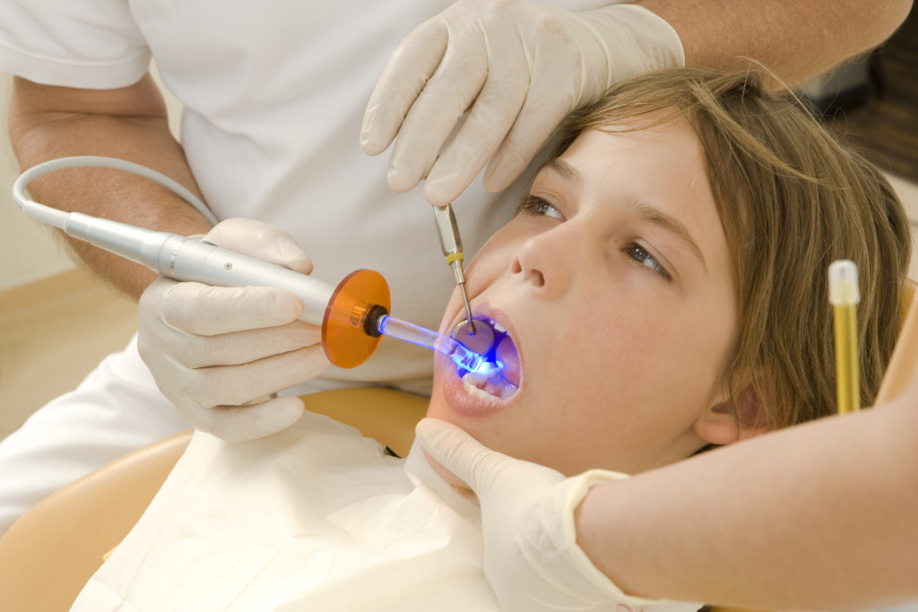 Scared child getting tooth checked