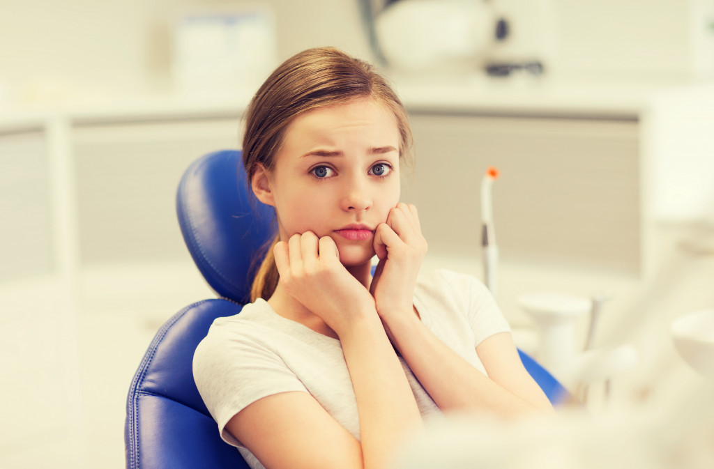 a girl with dental anxiety